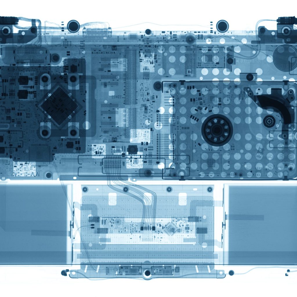 Notebook under the X-rays in blue tones on white background